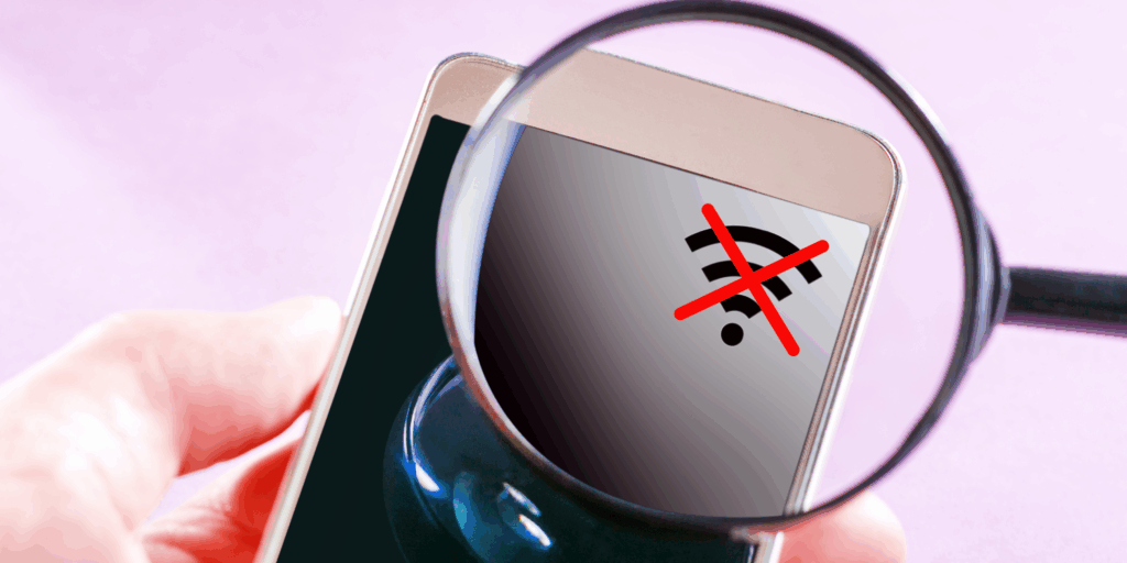Smartphone showing no signal icon under magnifying glass — representing poor phone reception and network issues explained by Cellular Zone SA